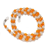 En kæde til briller, perler, en orange pendant