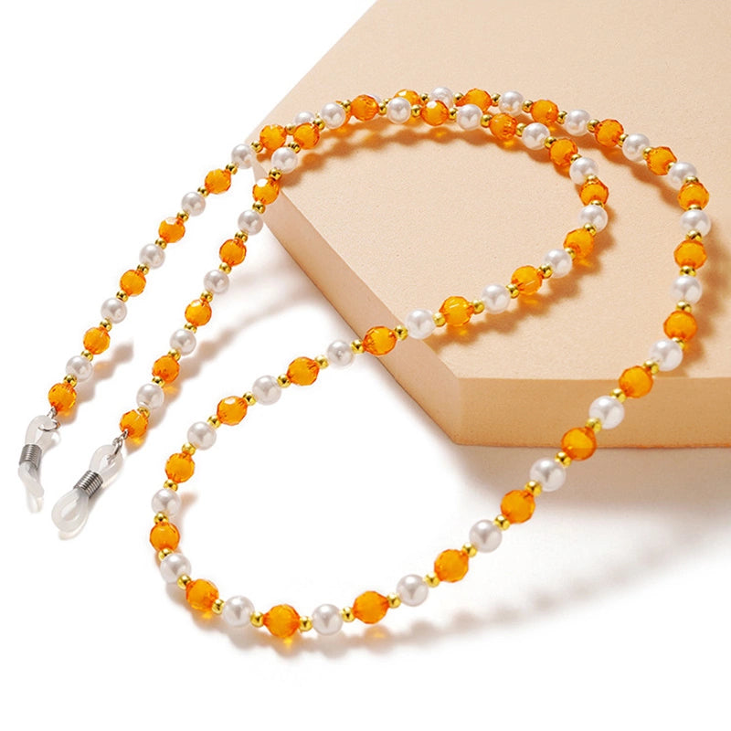 En kæde til briller, perler, en orange pendant
